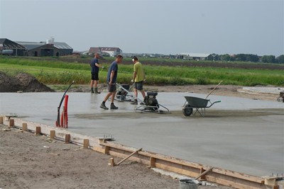 Instrooien met slijtvast materiaal